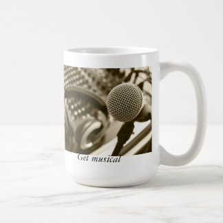 A microphone and headphones coffee mug
