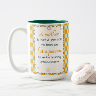 A mother is not a person to lean on, but a person  Two-Tone coffee mug