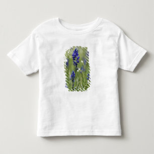 A mountain meadow of wildflowers including toddler T-Shirt