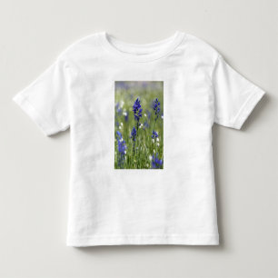 A mountain meadow of wildflowers including toddler T-Shirt