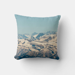 A mountain range with thawing snow and ice in the cushion