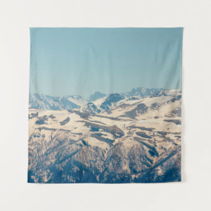 A mountain range with thawing snow and ice in the tapestry