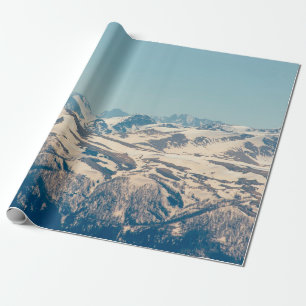 A mountain range with thawing snow and ice in the wrapping paper