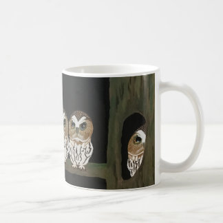 A mug depicting four little owls
