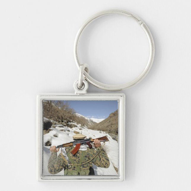 A Mujahadeen Guard walks with US Military membe Key Ring (Front)