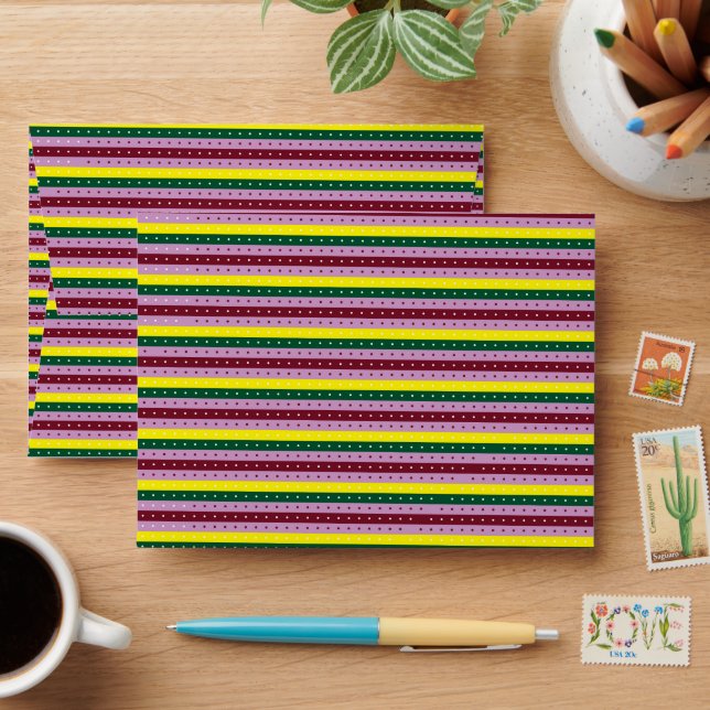 a multicolored striped background with dots envelope (Desk)
