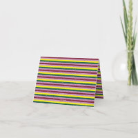 a multicolored striped background with dots