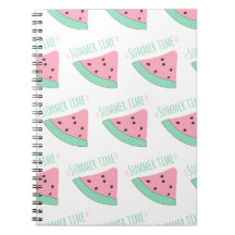 A notebook with an inscription and a watermelon
