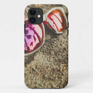 A Pair Of Fashionable Sunglasses On The Beach iPhone 11 Case