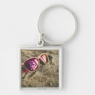 A Pair Of Fashionable Sunglasses On The Beach Key Ring