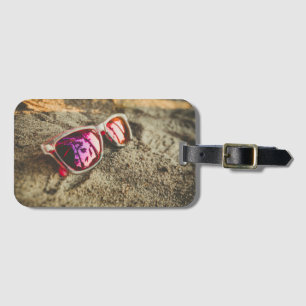 A Pair Of Fashionable Sunglasses On The Beach Luggage Tag
