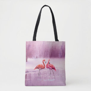 A pair of pink flamingos stand in the water on the tote bag