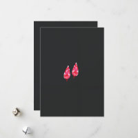 a pair of red leaves on a black background