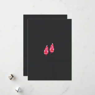 a pair of red leaves on a black background holiday card