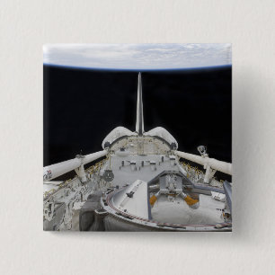 A partial view of Space Shuttle 15 Cm Square Badge