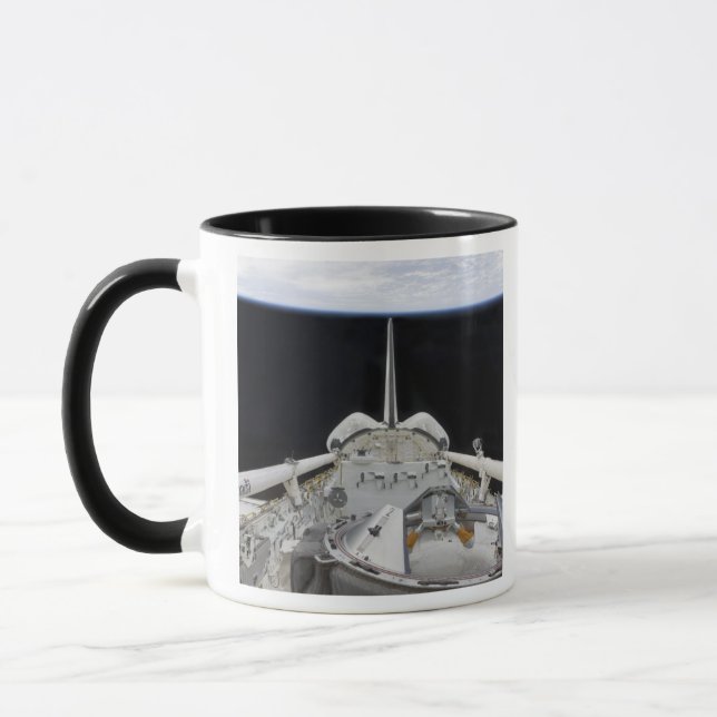 A partial view of Space Shuttle Mug (Left)