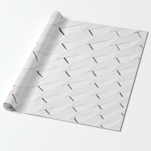 A pattern of white geometric shapes in a facade wrapping paper