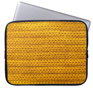 A pattern of yellow knitted fabric of yarn. laptop sleeve