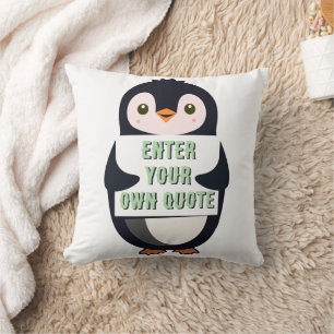 A penguin holding a sign with customizable text cushion