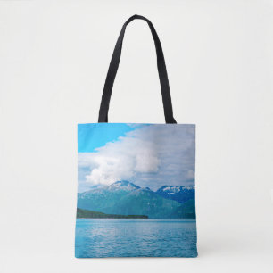 A peninsula of land covered in pine forest juts ou tote bag