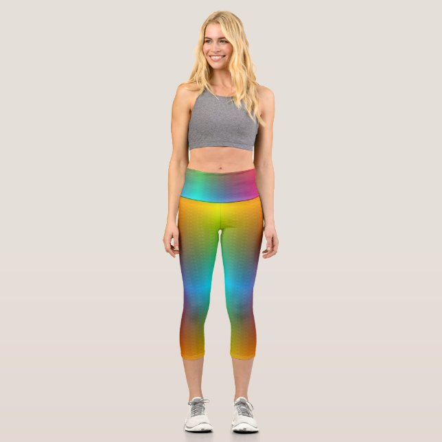 A person wearing vibrant, rainbow-gradient legging (Front)