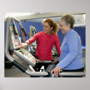 A personal trainer helps a senior woman on a poster