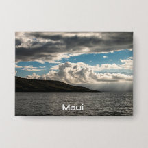 A pin featuring clouds over Maui 