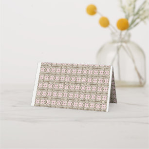 a pink and brown pattern on a white background place card