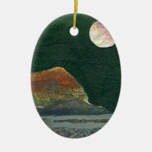 A pink and green moon rises over an alien world ceramic ornament