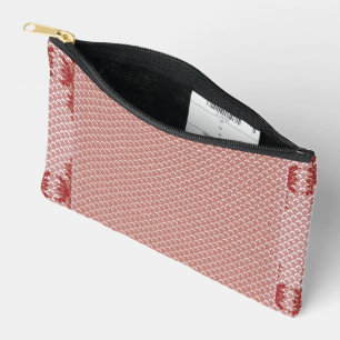 a pink and white background with a pattern accessory pouch