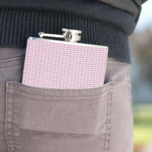 a pink and white background with wavy lines hip flask