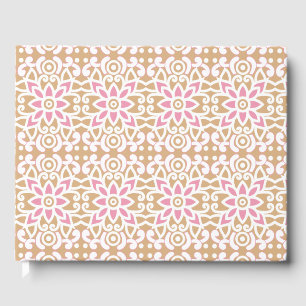 a pink and white flower pattern on a brown backgro guest book