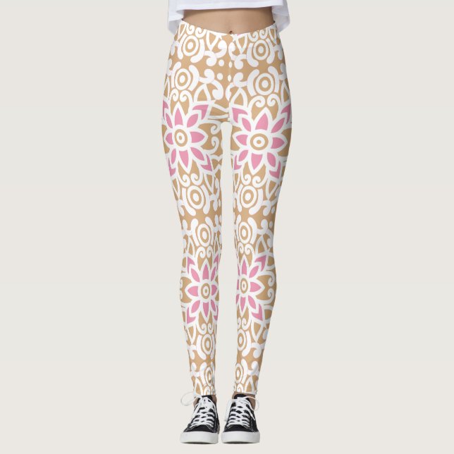 a pink and white flower pattern on a brown backgro leggings (Front)