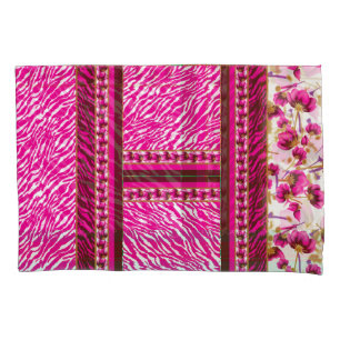a pink and white wallpaper with a cross on it pillowcase