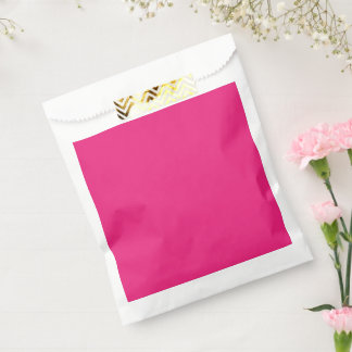 a pink background with a black favour bag