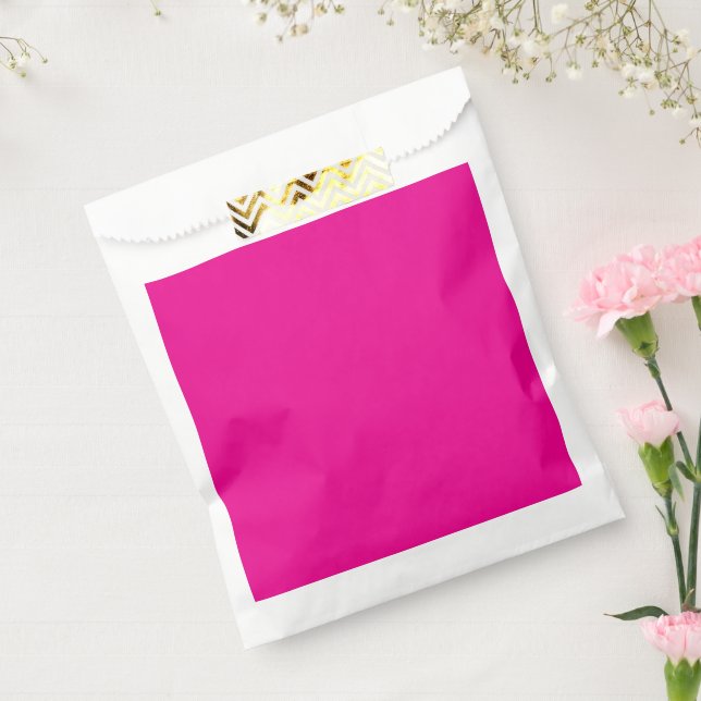 a pink background with a  favour bag (Sealed)