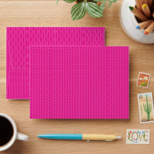 a pink background with a pattern of circles envelope