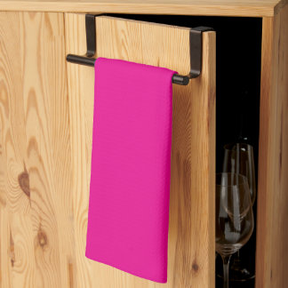 a pink background with a  tea towel