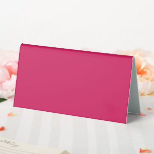 a pink background with a white border