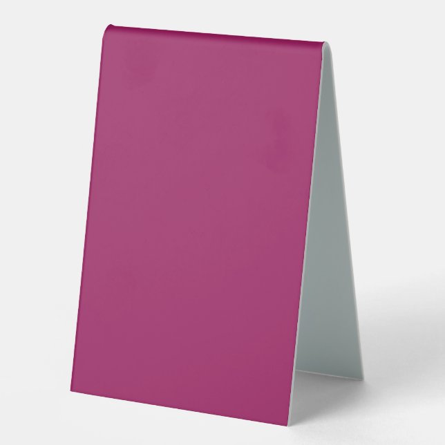 a pink background with a white border (Front)