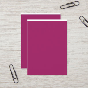 a pink background with a white border business card