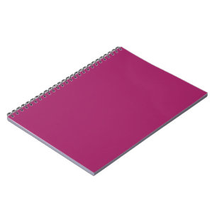 a pink background with a white border notebook