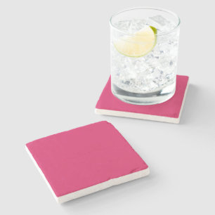 a pink background with a white border stone coaster