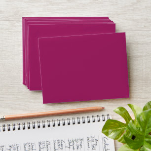 a pink background with a white envelope