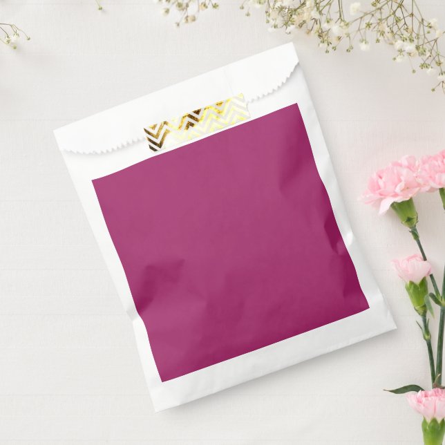 a pink background with a white favour bag (Sealed)