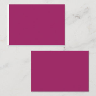 a pink background with a white place card