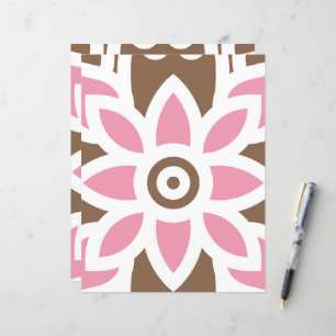 a pink flower on a brown background