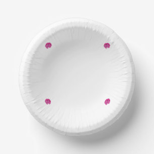A pink flower with black spots on its petals, show paper plate