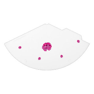 A pink flower with black spots on its petals, show party hat