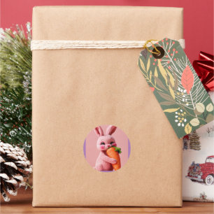 A pink rabbit hugs a carrot classic round sticker